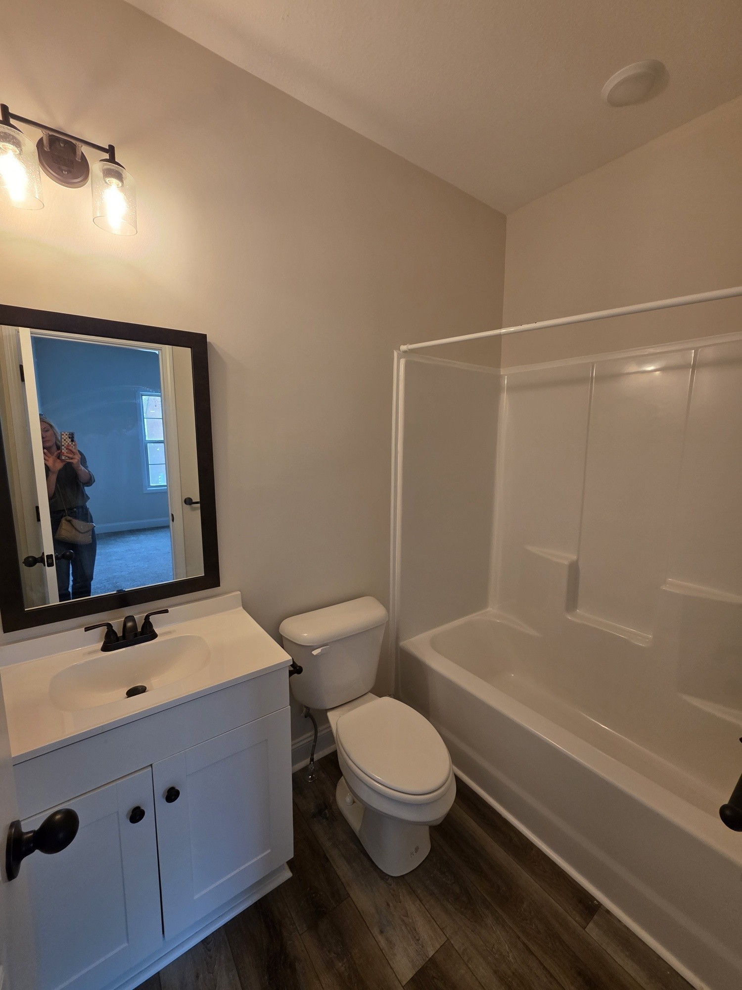 550 Peachers Mill Road, Unit E2 Clarksville, TN 37042 - Photo 10 of 11 a bathroom with a sink a toilet and shower