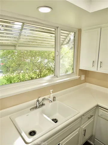 a bathroom with a tub sink and a mirror