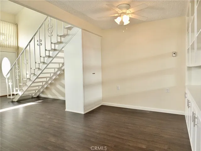 a view of a room with wooden floor