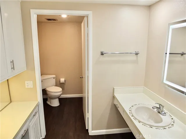 a view of a glass door and a yard from a balcony