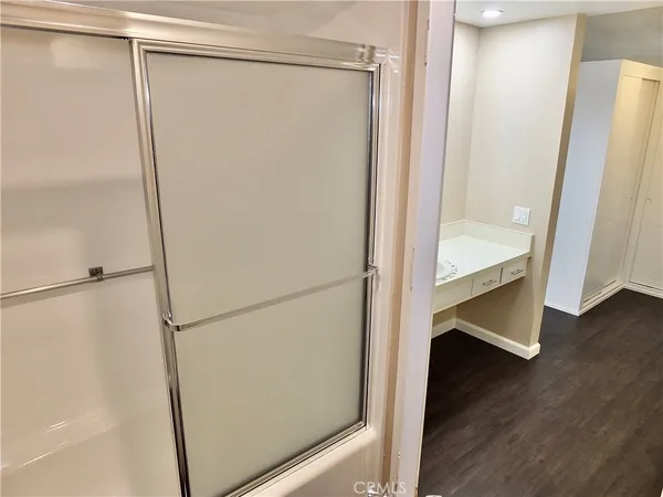 a front view of a house with a garden and trees