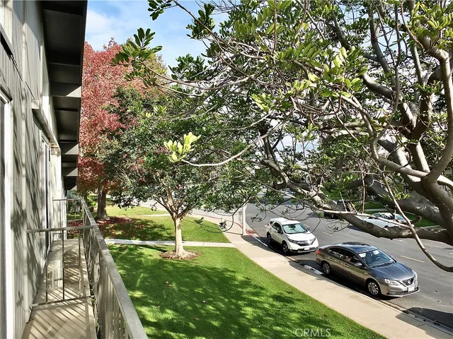 a view of a big yard with a fountain