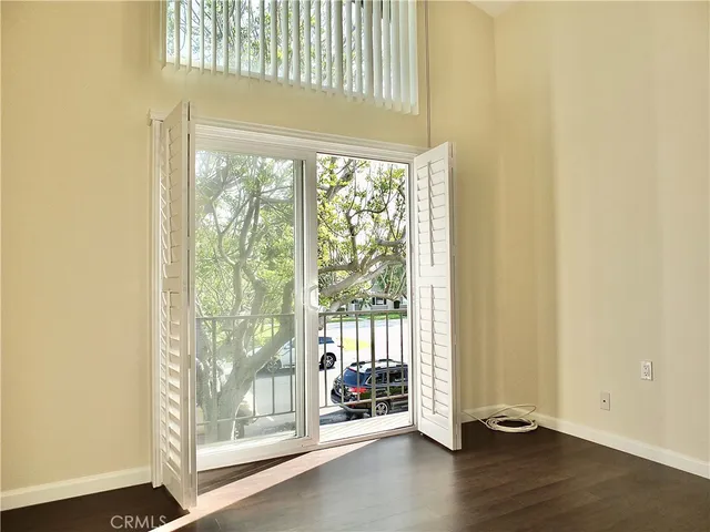 a view of a livingroom with furniture and hardwood floor