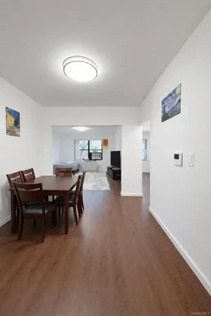 a view of a dining room with furniture and chandelier