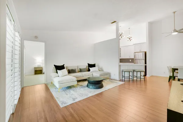 a living room with furniture and a table