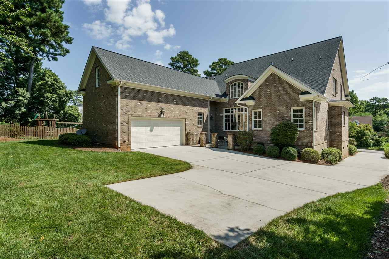 1315 Mayfair Road Raleigh, NC 27608 - Photo 24 of 25 ...shows a generous driveway/parking area and a beautiful, grassy lawn Rear View