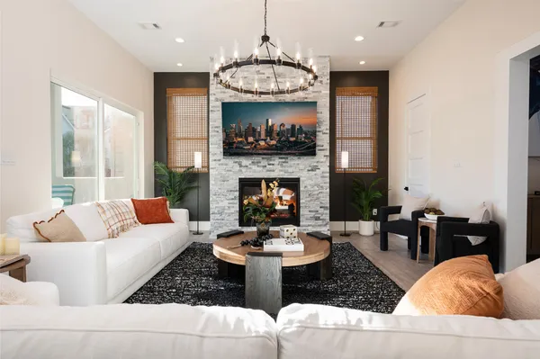 a living room with furniture and a fireplace
