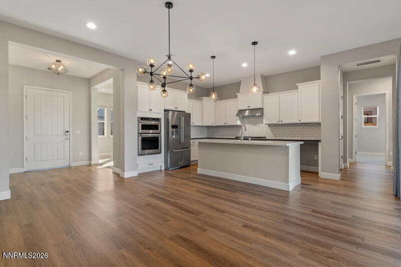 2221 Paint Horse Drive Reno, NV 89521 - Photo 20 of 53 a view of kitchen with granite countertop cabinets and refrigerator
