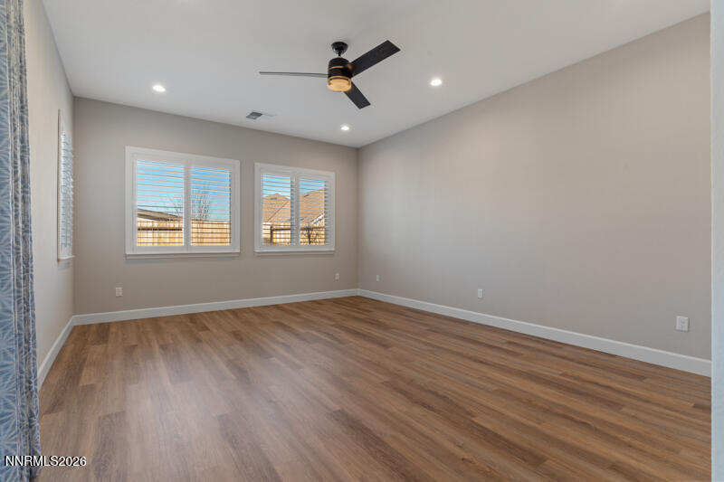 2221 Paint Horse Drive Reno, NV 89521 - Photo 23 of 53 an empty room with wooden floor and windows