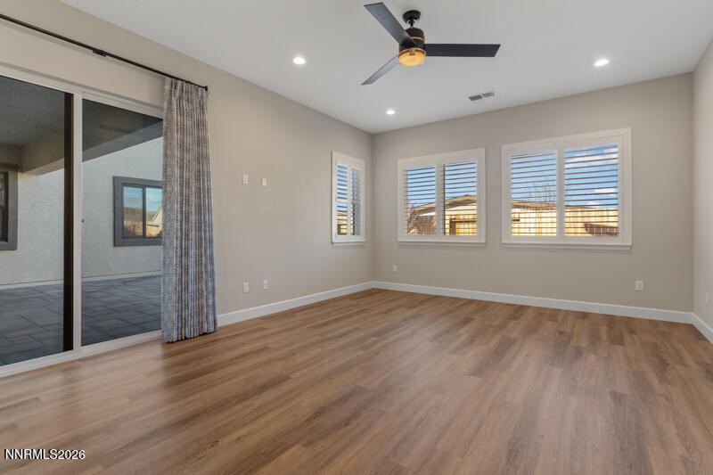 2221 Paint Horse Drive Reno, NV 89521 - Photo 25 of 53 an empty room with wooden floor and windows