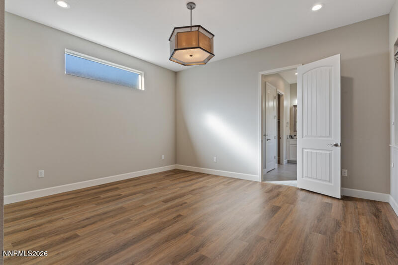 2221 Paint Horse Drive Reno, NV 89521 - Photo 30 of 53 a view of an empty room with wooden floor and a window