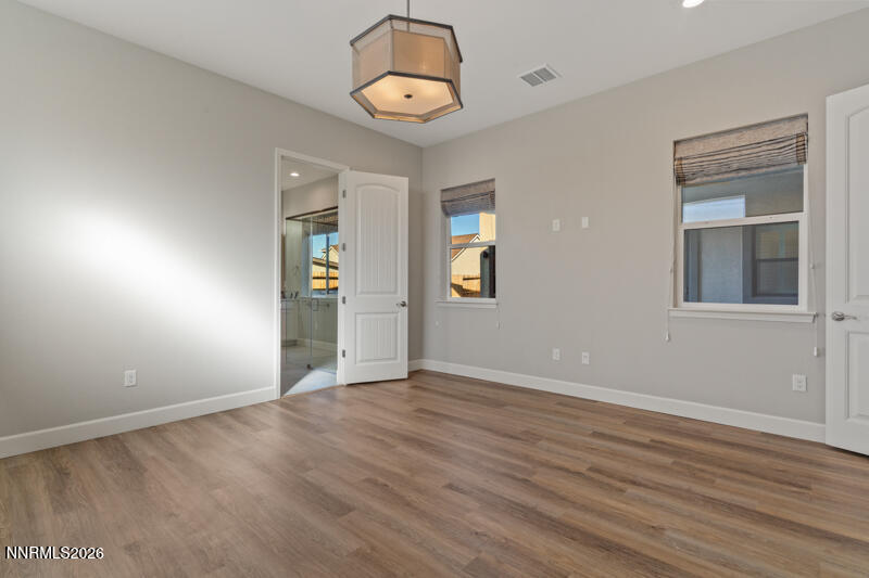 2221 Paint Horse Drive Reno, NV 89521 - Photo 31 of 53 an empty room with wooden floor and windows
