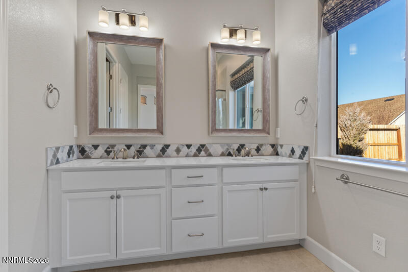 2221 Paint Horse Drive Reno, NV 89521 - Photo 33 of 53 a bathroom with double sink and a mirror