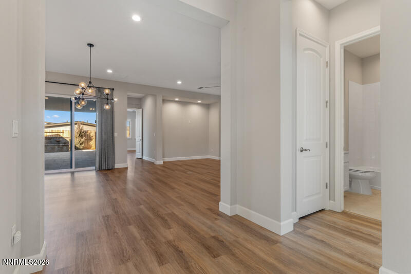 2221 Paint Horse Drive Reno, NV 89521 - Photo 4 of 53 a view of a hallway with a room and wooden floor