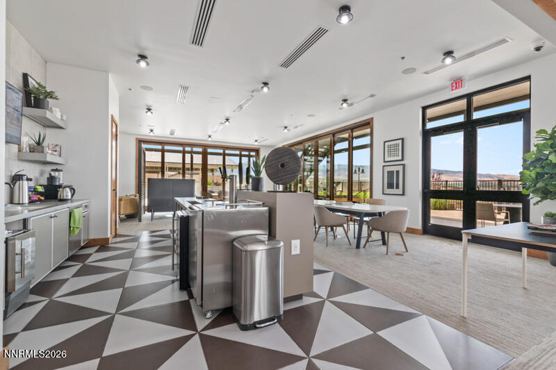 2221 Paint Horse Drive Reno, NV 89521 - Photo 46 of 53 a living room with furniture a floor to ceiling window and wooden floor