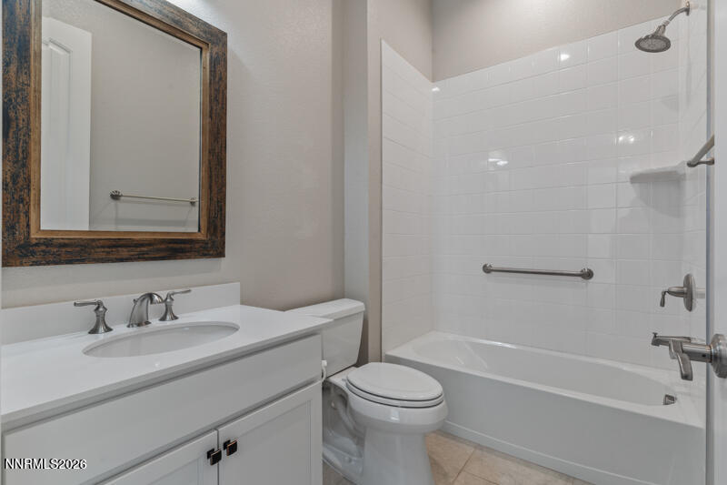 2221 Paint Horse Drive Reno, NV 89521 - Photo 10 of 53 a bathroom with a sink a toilet and shower