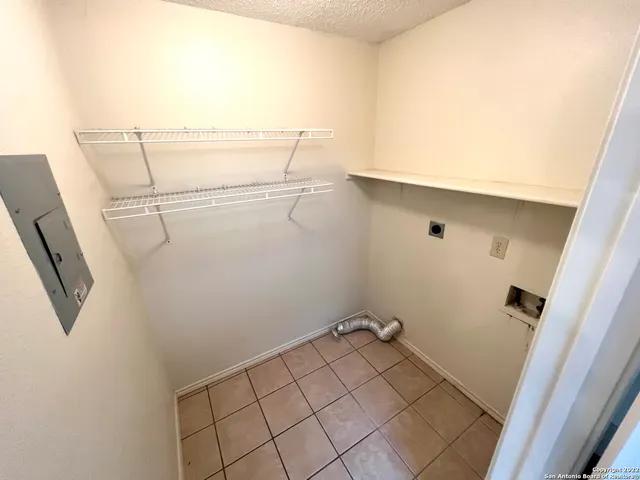 a view of a room with racks on the wall