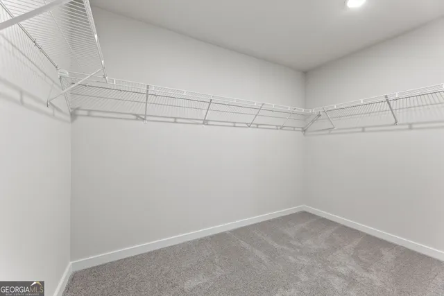 a house view with a swimming pool and sitting area