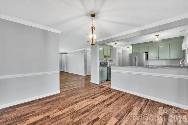 a view of a kitchen cabinets and wooden floor