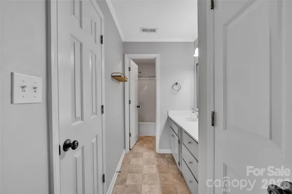 a bathroom with a double vanity sink and mirror