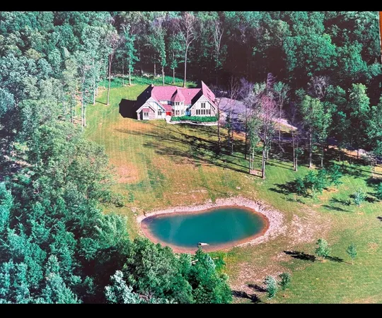a view of a lake with a yard