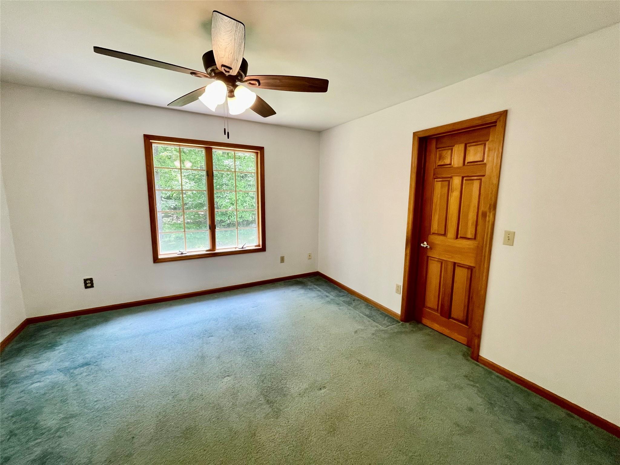 71 Saddleback Ridge Wallkill, NY 12589 - Photo 18 of 39 an empty room with windows and fan