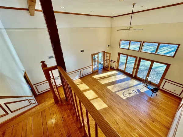 a balcony with a table and chairs