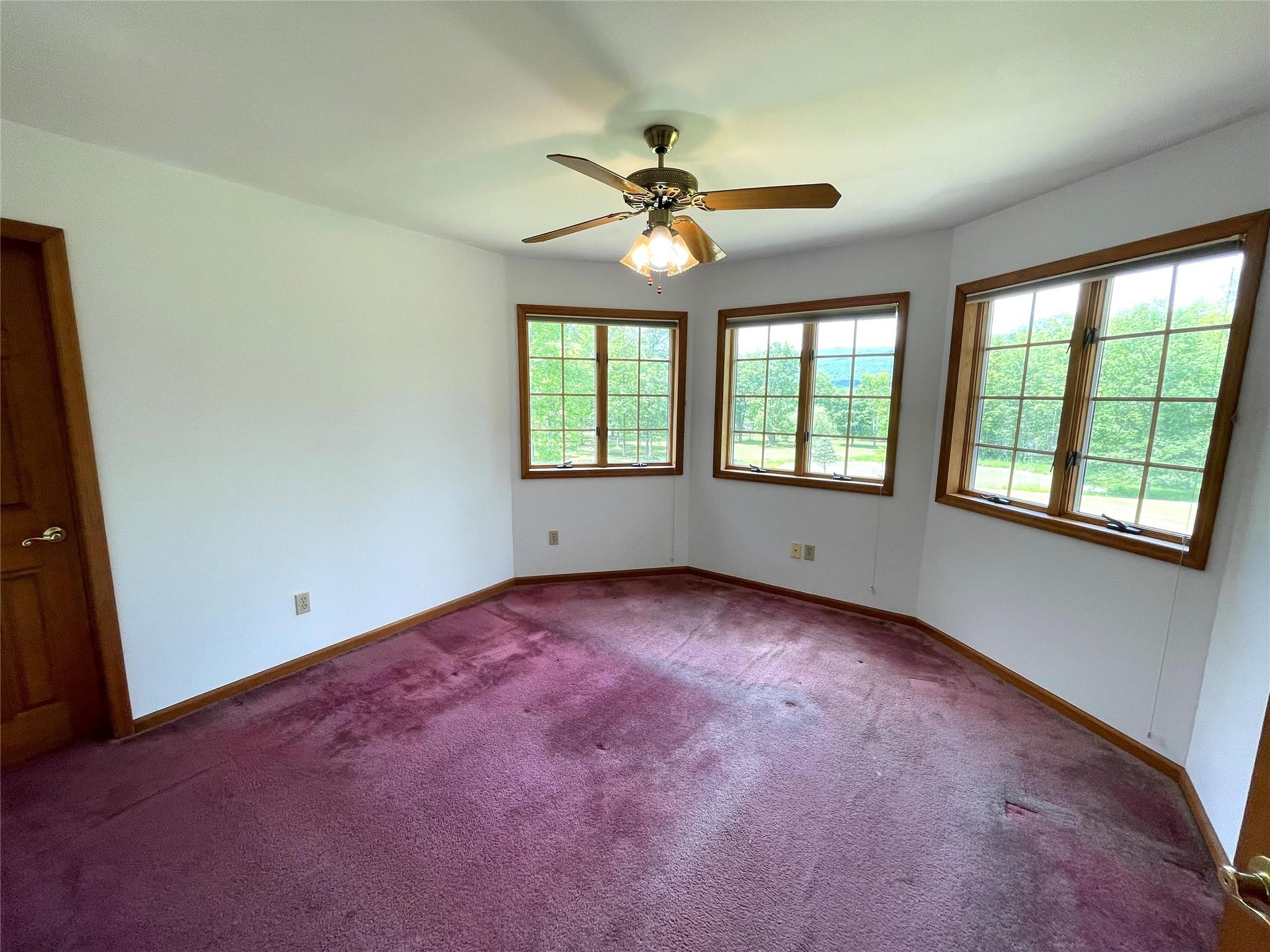 71 Saddleback Ridge Wallkill, NY 12589 - Photo 36 of 39 an empty room with a window and a fan