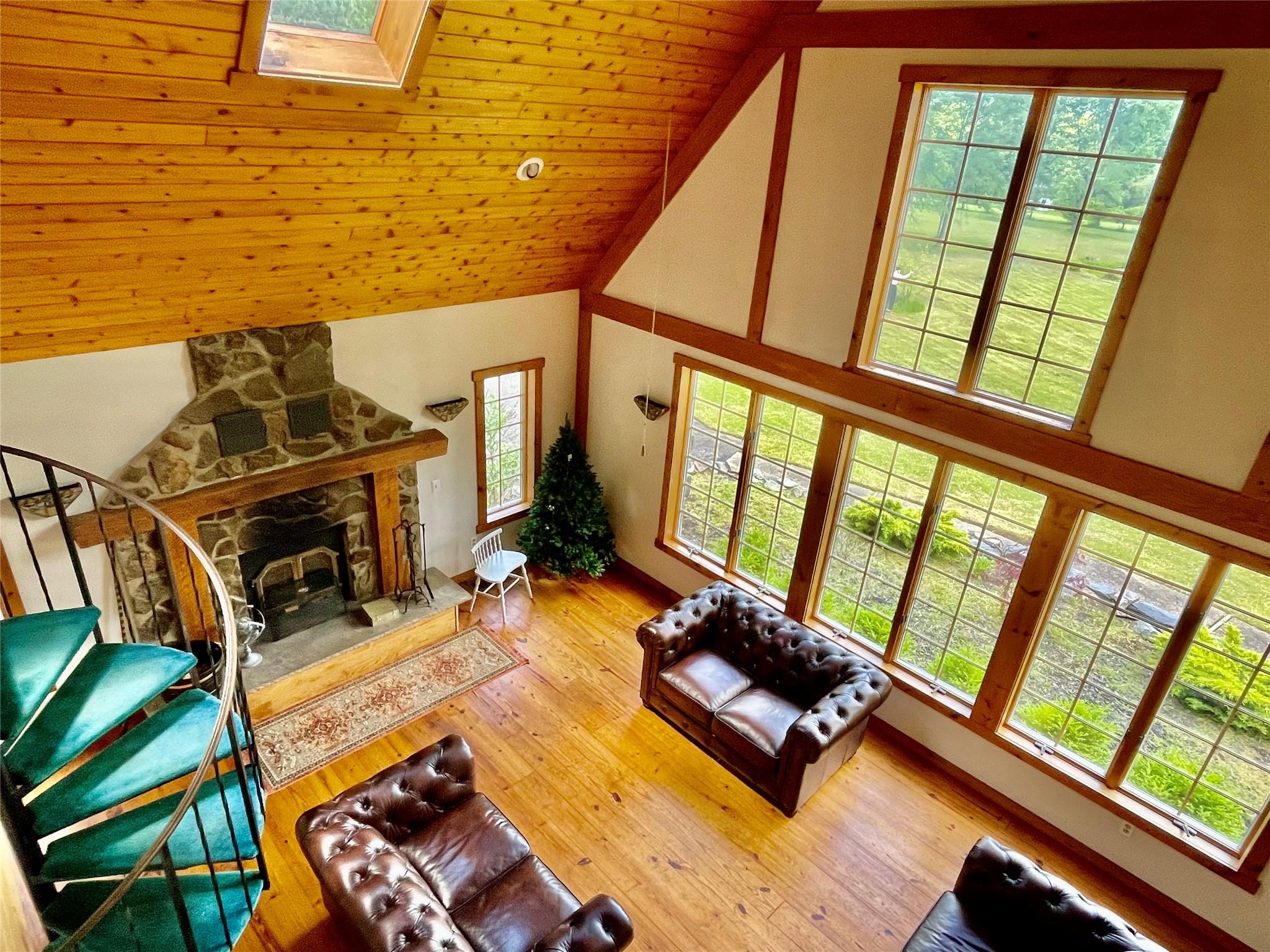 71 Saddleback Ridge Wallkill, NY 12589 - Photo 38 of 39 a living room with furniture floor to ceiling windows and a flat screen tv