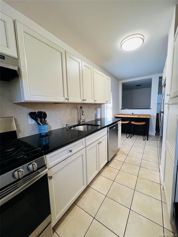 93 Main Street Garnerville, NY 10923 - Photo 12 of 15 a kitchen with a sink and cabinets