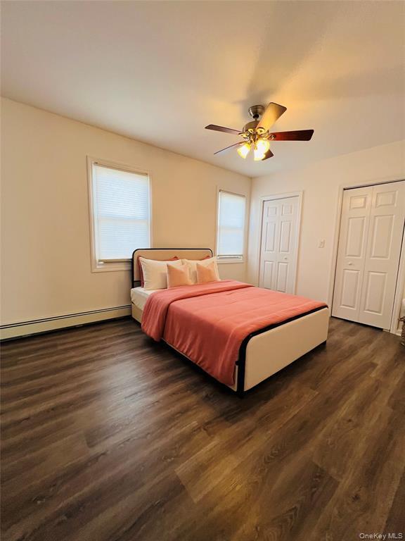 93 Main Street Garnerville, NY 10923 - Photo 14 of 15 a bedroom with a bed and wooden floor