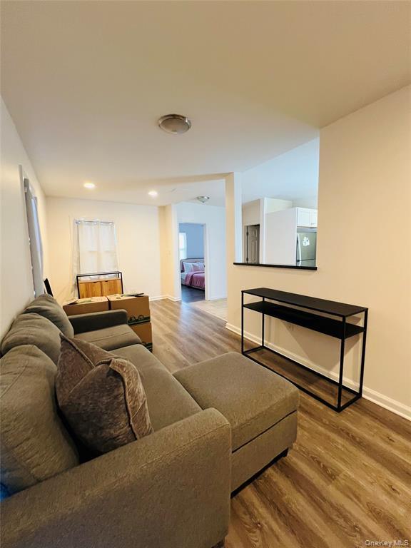 93 Main Street Garnerville, NY 10923 - Photo 15 of 15 a living room with furniture and a wooden floor