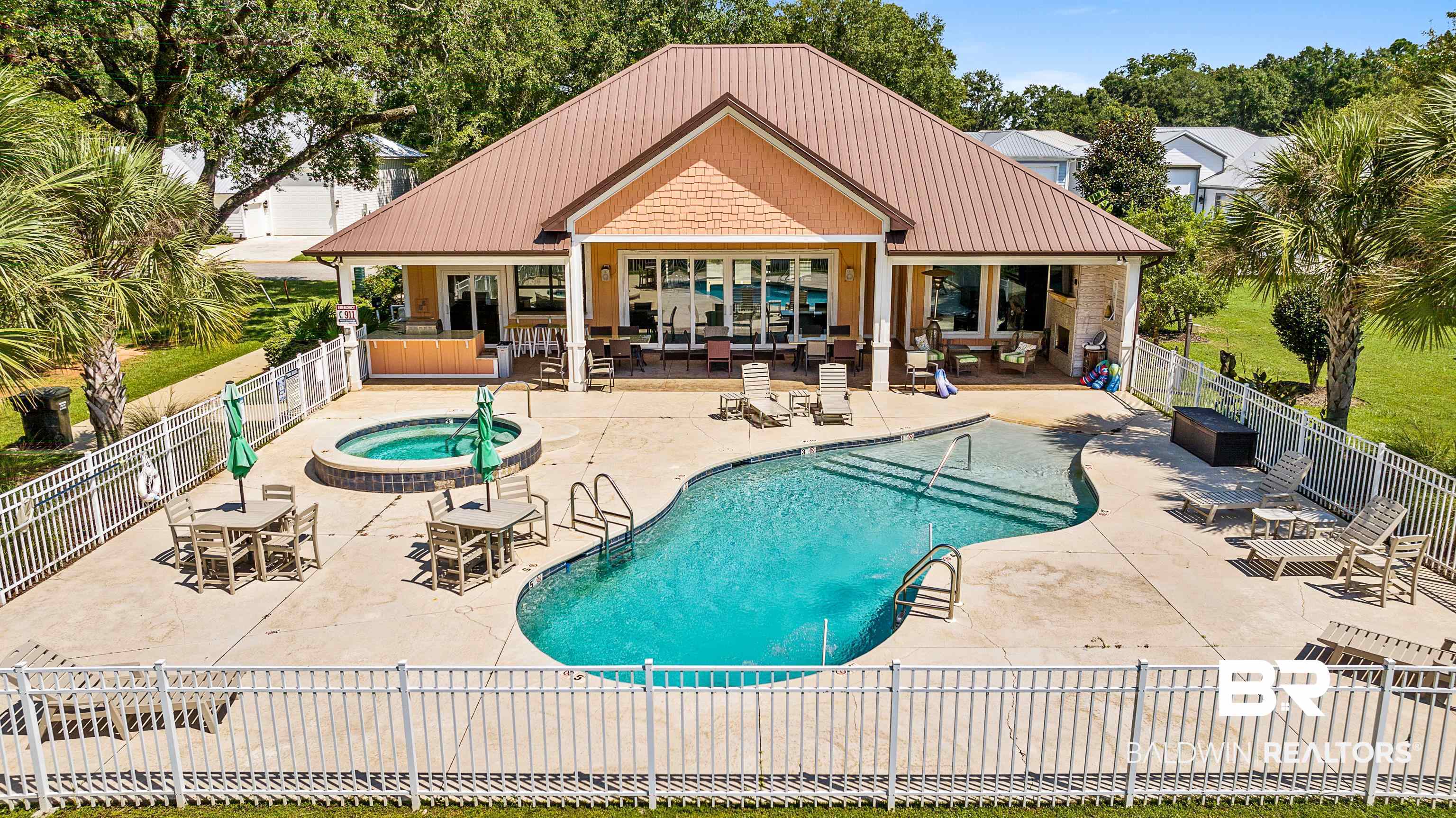 12329 Reunion Place, Unit LOT 38 Foley, AL 36535 - Photo 41 of 43 Community pool with a community hot tub and a patio area