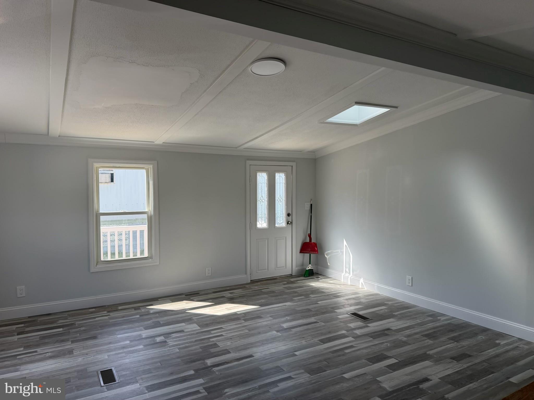300 Ridge Road, Unit 11 Etters, PA 17319 - Photo 11 of 30 an empty room with wooden floor and windows
