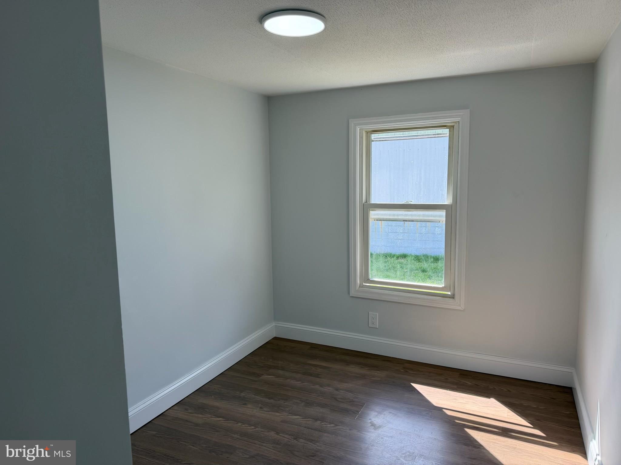 300 Ridge Road, Unit 11 Etters, PA 17319 - Photo 24 of 30 an empty room with wooden floor and windows