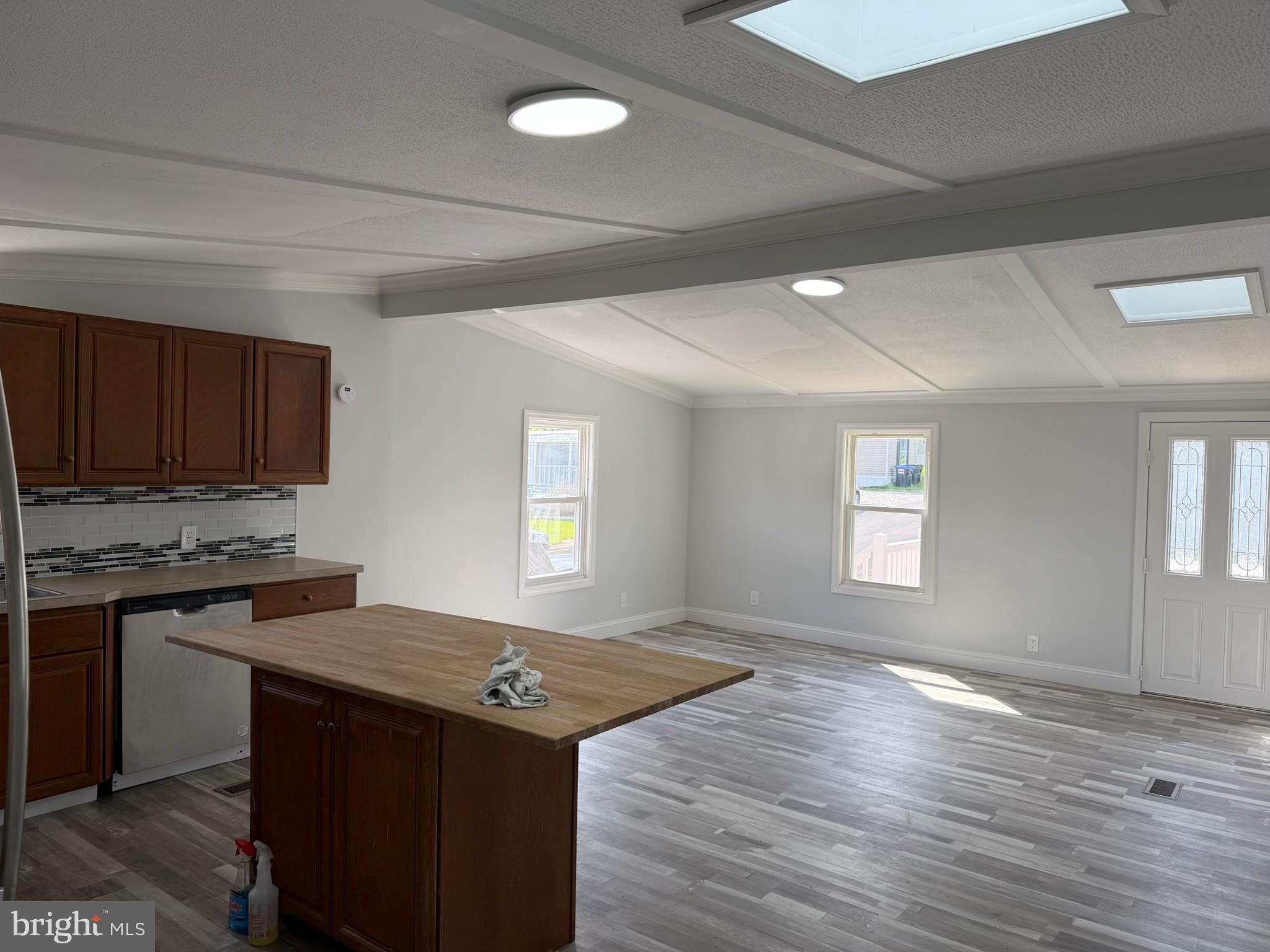 300 Ridge Road, Unit 11 Etters, PA 17319 - Photo 9 of 30 a kitchen with granite countertop a stove and a wooden floors