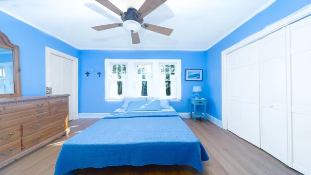 a bedroom with a bed and a dresser