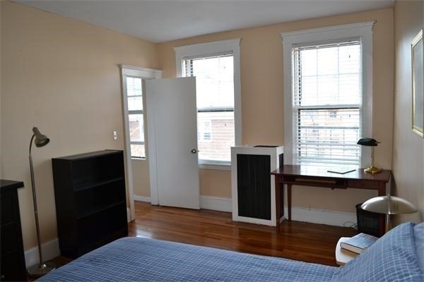 110 Lanark Road, Unit 5 Boston, MA 02135 - Photo 7 of 17 a living room with furniture and a window