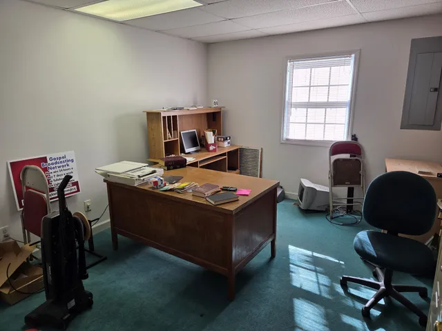 a room with gym equipment and a table