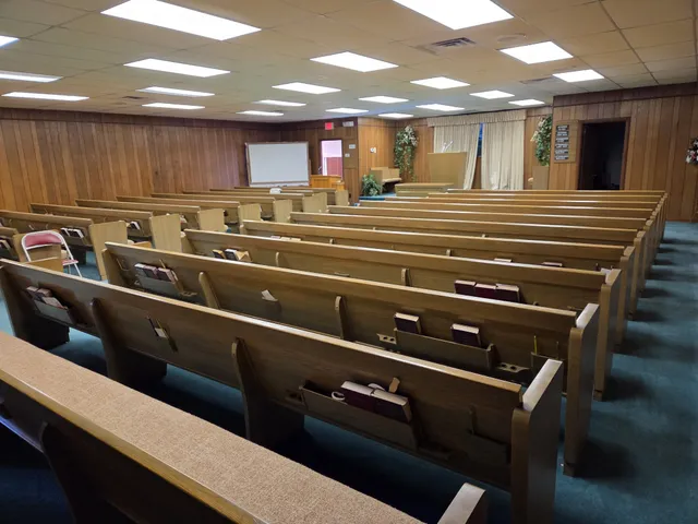a kitchen with kitchen island a sink and a stove