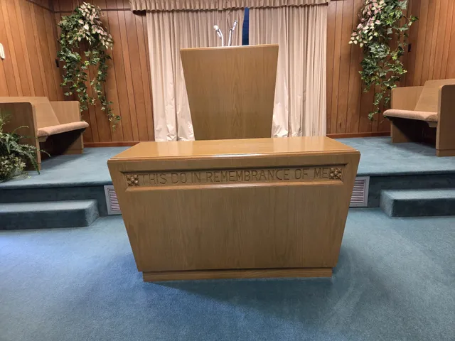 a view of living room with furniture and a potted plant