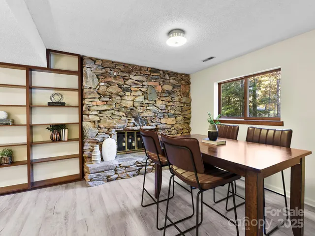 a view of a dining room with furniture and window