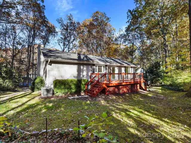 a view of a house with backyard porch and sitting area