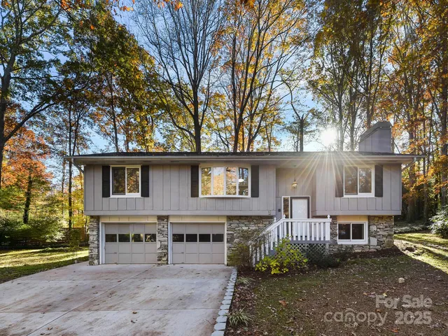 a house that has a tree in front of it