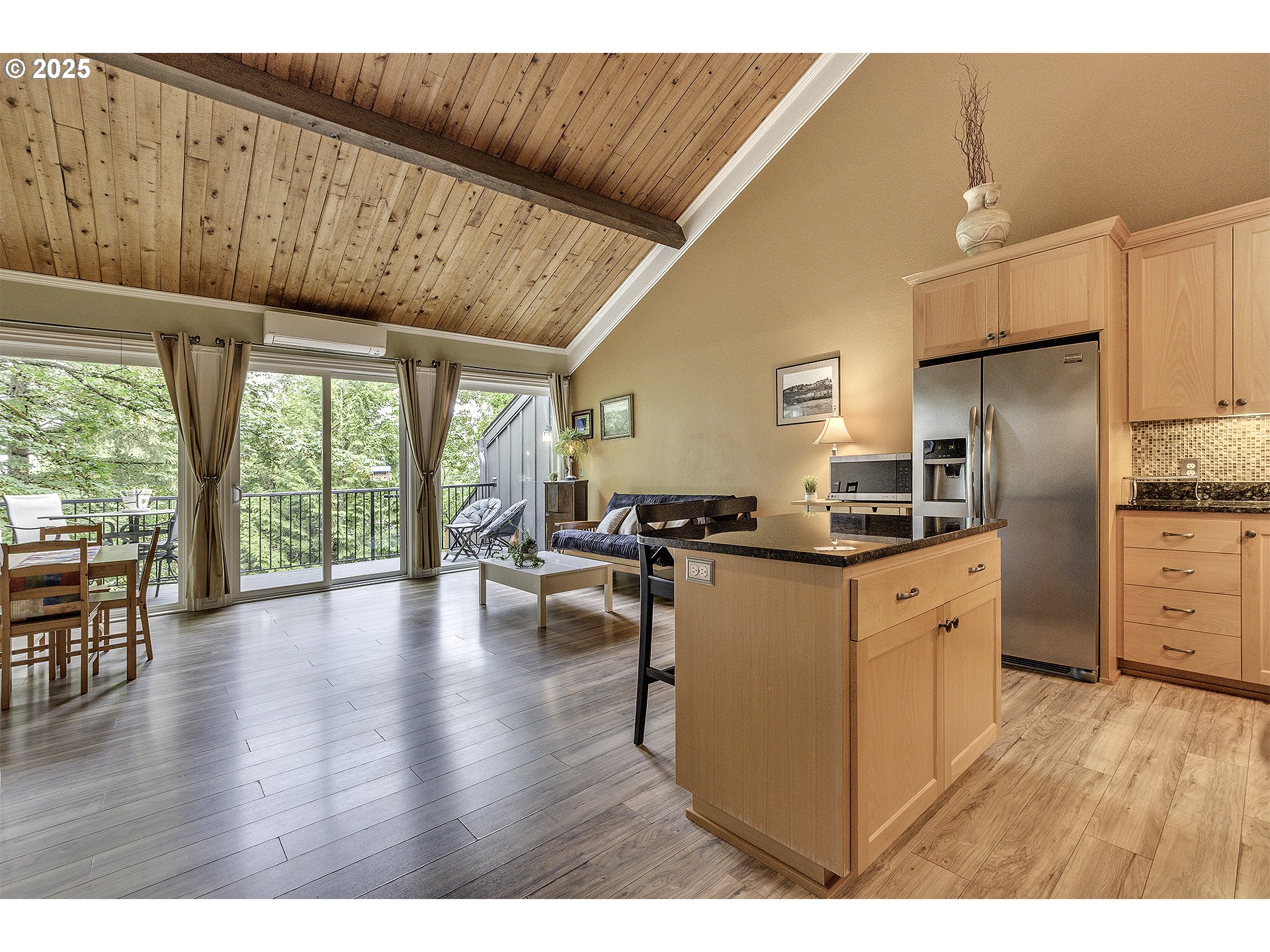 4 Touchstone, Unit 113 Lake Oswego, OR 97035 - Photo 4 of 32 a kitchen with stainless steel appliances kitchen island hardwood floor and a large window