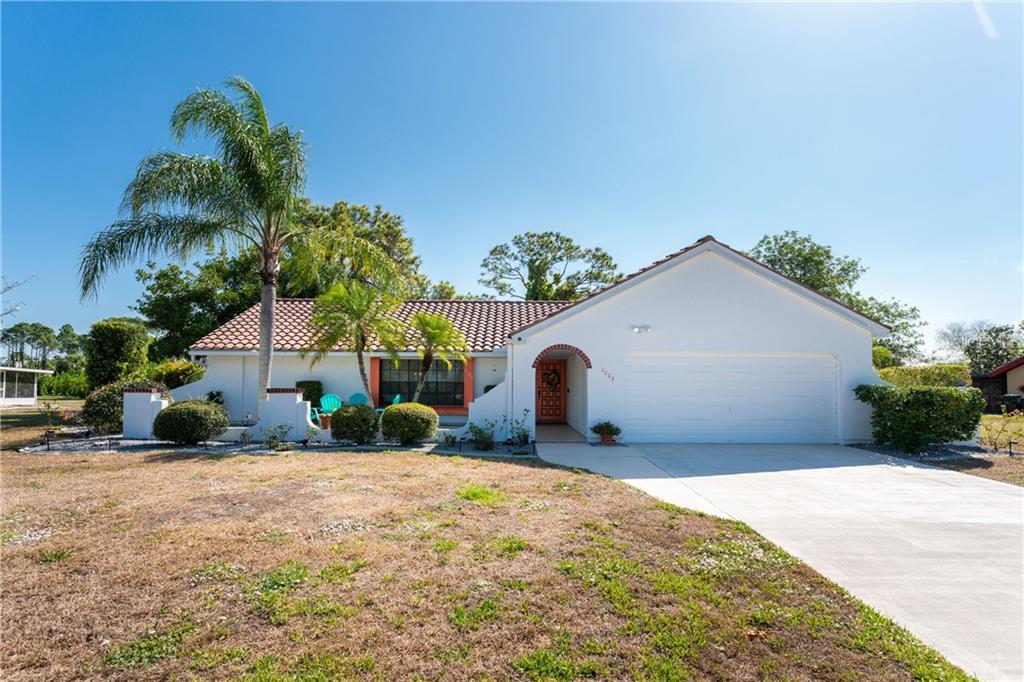 5084 Kingsley Road North Port, FL 34287 - Photo 1 of 1 a front view of a house with a yard and garage