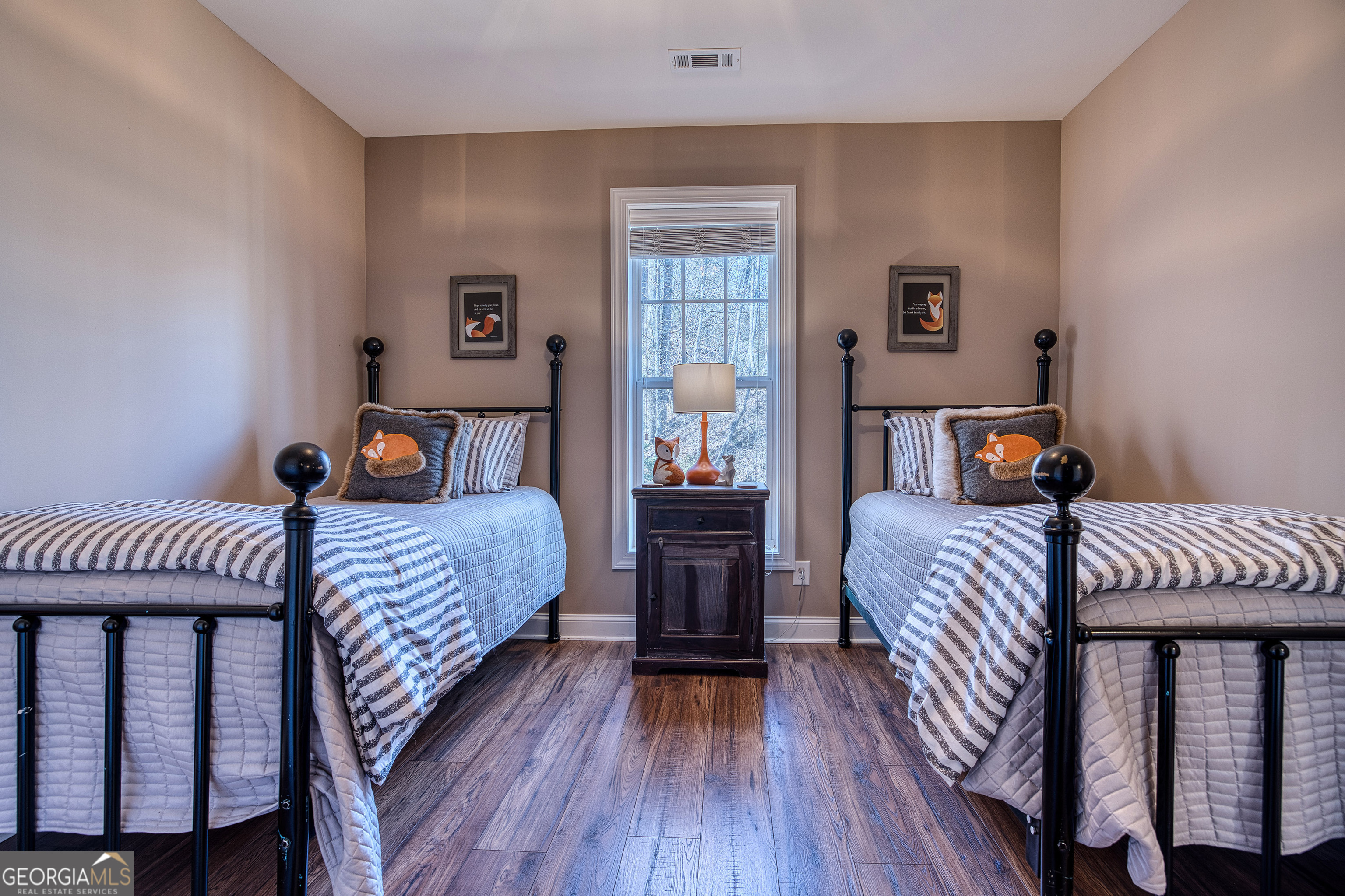 112 Springhill Lane Clarkesville, GA 30523 - Photo 47 of 79 a bedroom with a bed and wooden floor