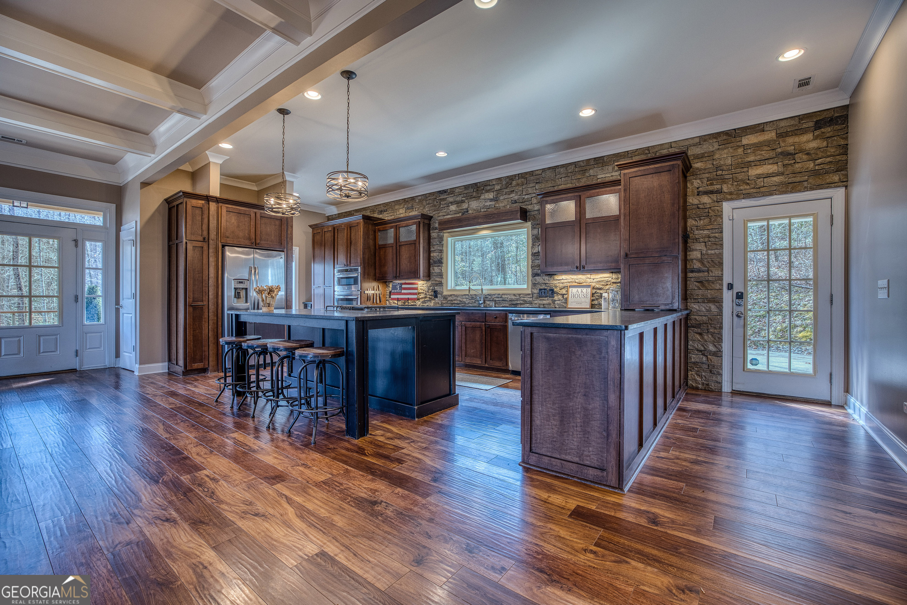 112 Springhill Lane Clarkesville, GA 30523 - Photo 5 of 79 a kitchen with stainless steel appliances granite countertop wooden floors and white walls