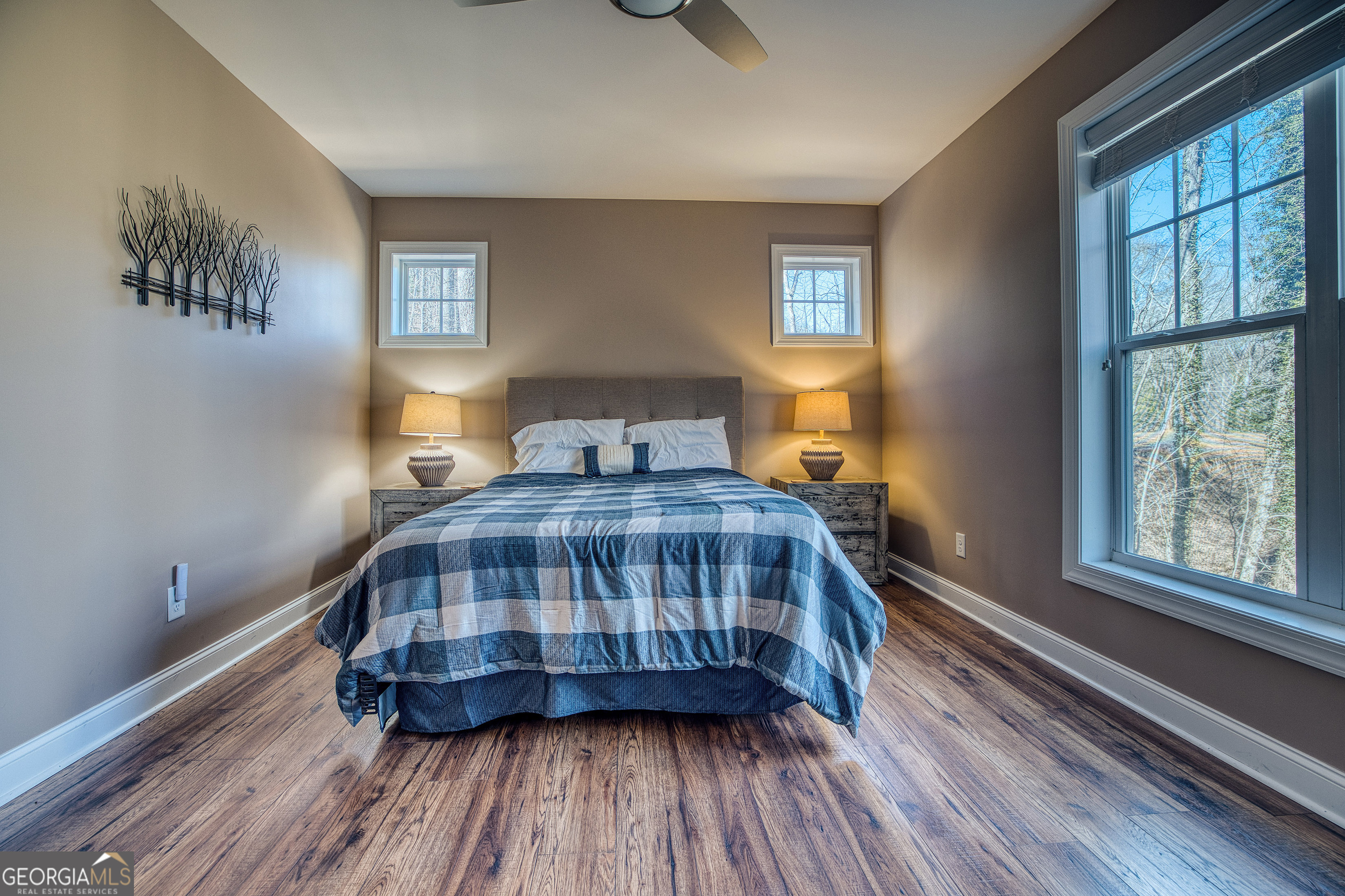 112 Springhill Lane Clarkesville, GA 30523 - Photo 54 of 79 a bedroom with a bed and wooden floor