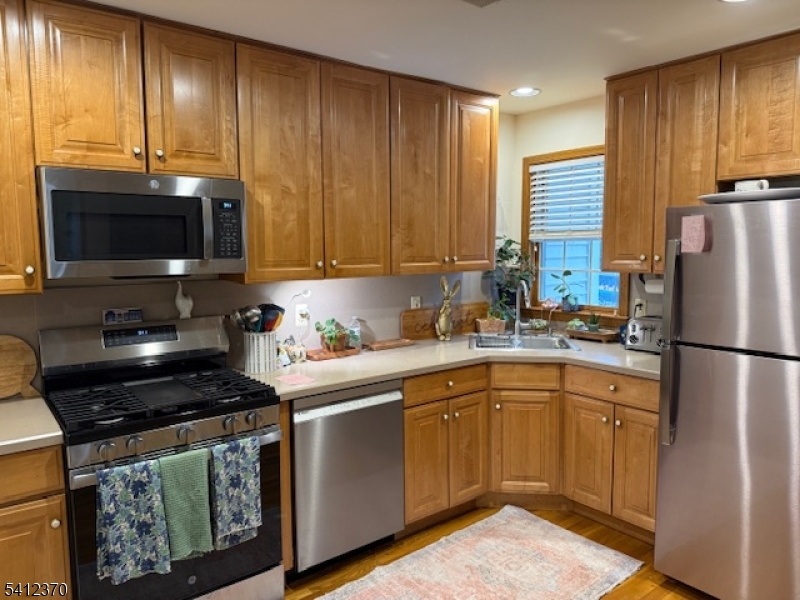 35 Seminary Avenue, Unit 3 Chester, NJ 07930 - Photo 5 of 9 a kitchen with a sink a stove and cabinets